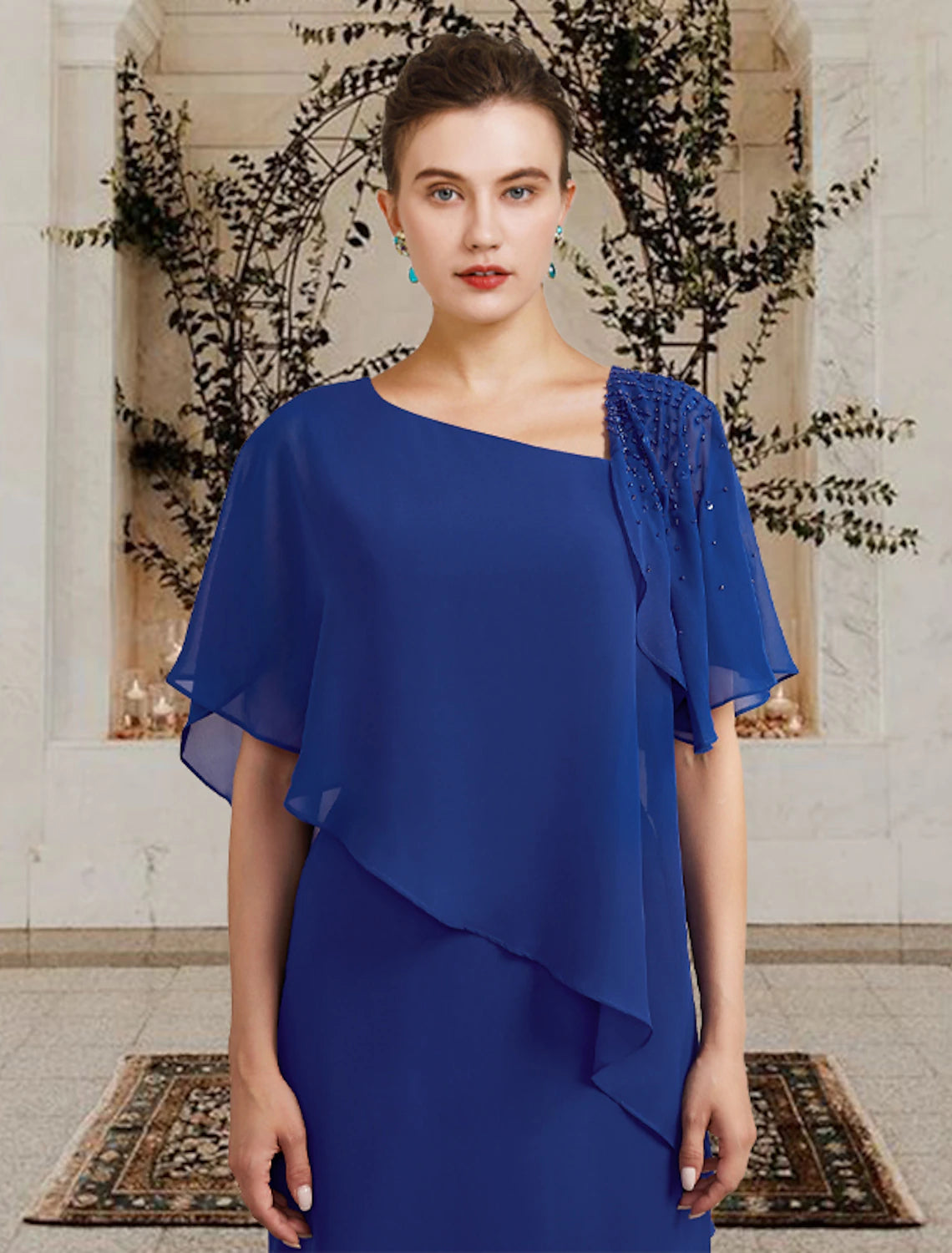 Back view of the elegant floor-length chiffon Mother of the Bride dress, showing the column silhouette and ruffle accents.