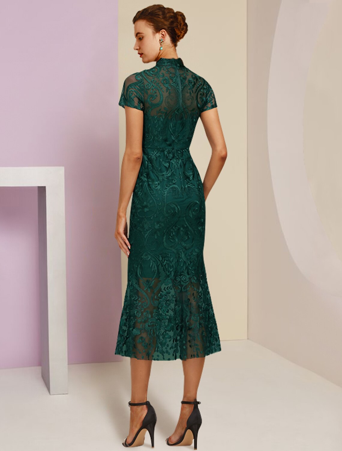 Side view of the elegant sheath dress, highlighting the short sleeves and lace details.