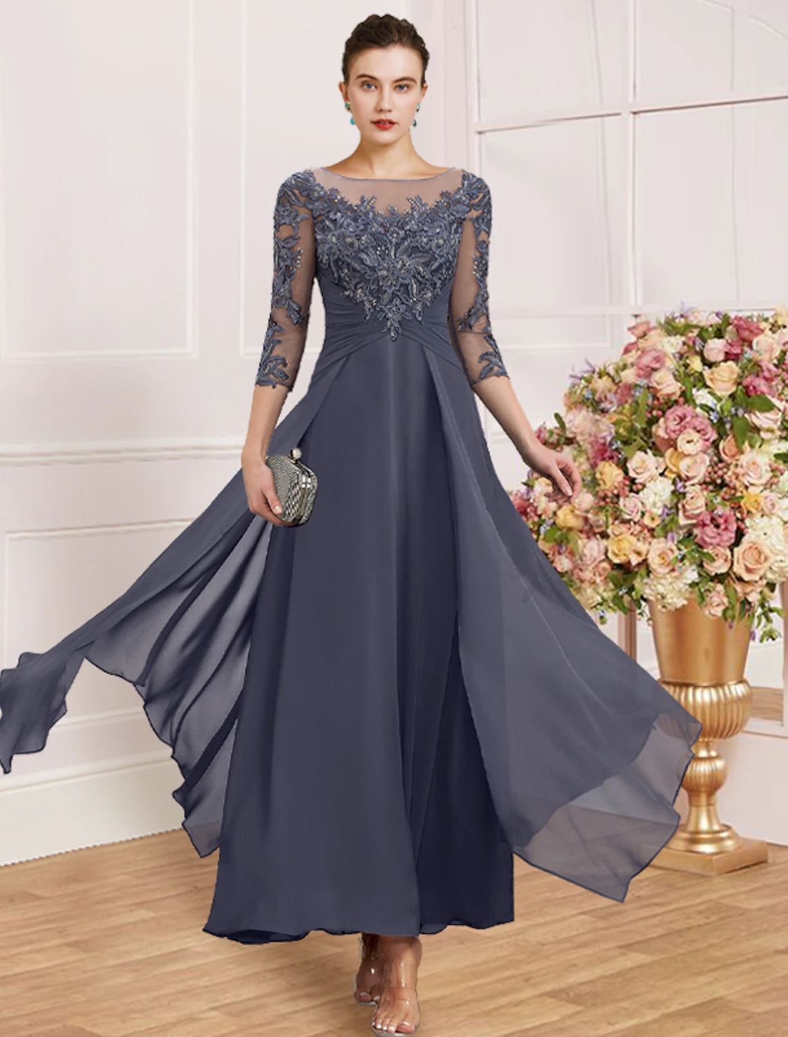 Model wearing an elegant blue sheath dress with jewel neck and 3/4 lace sleeves.