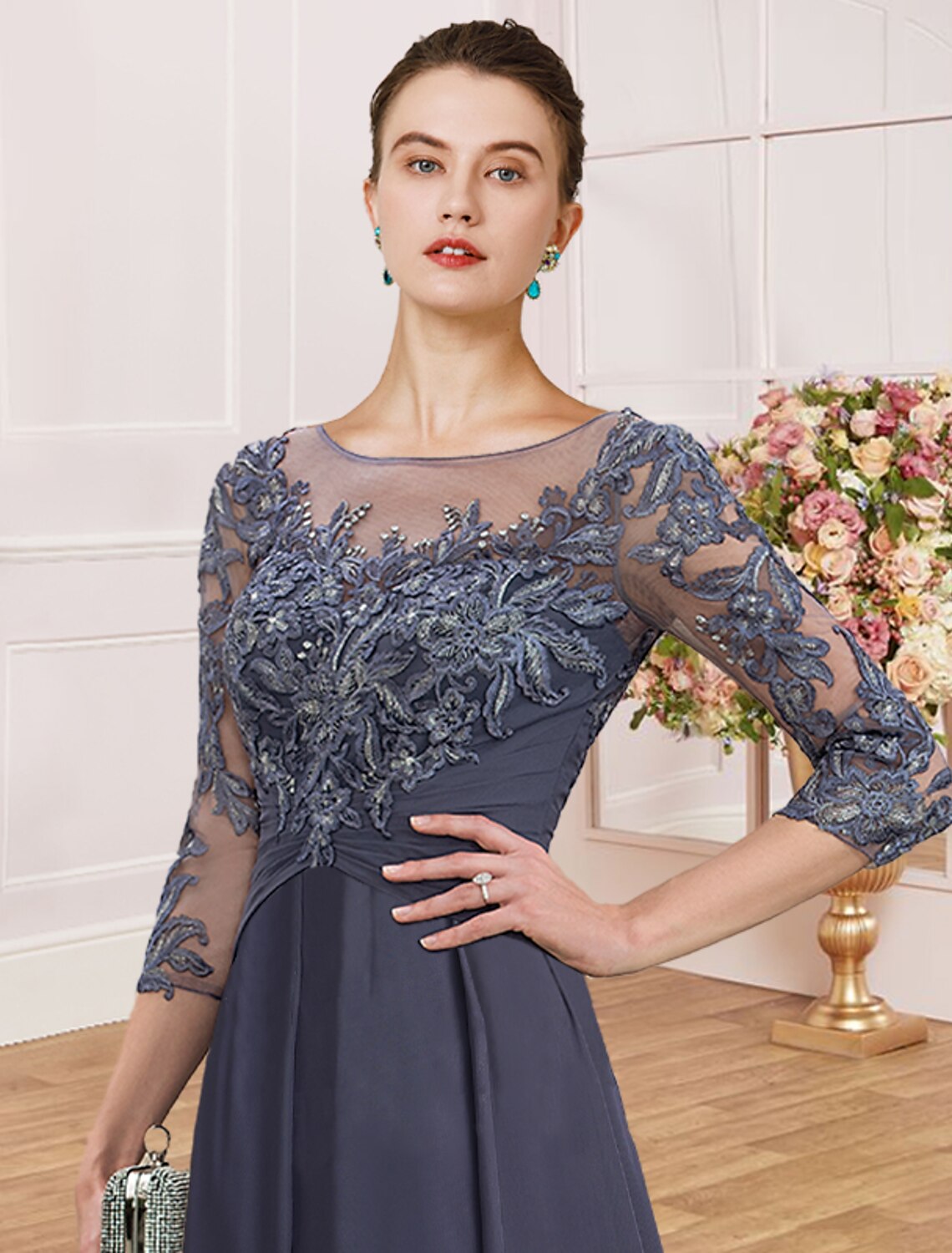 Side view of a model wearing a green ankle-length sheath dress.