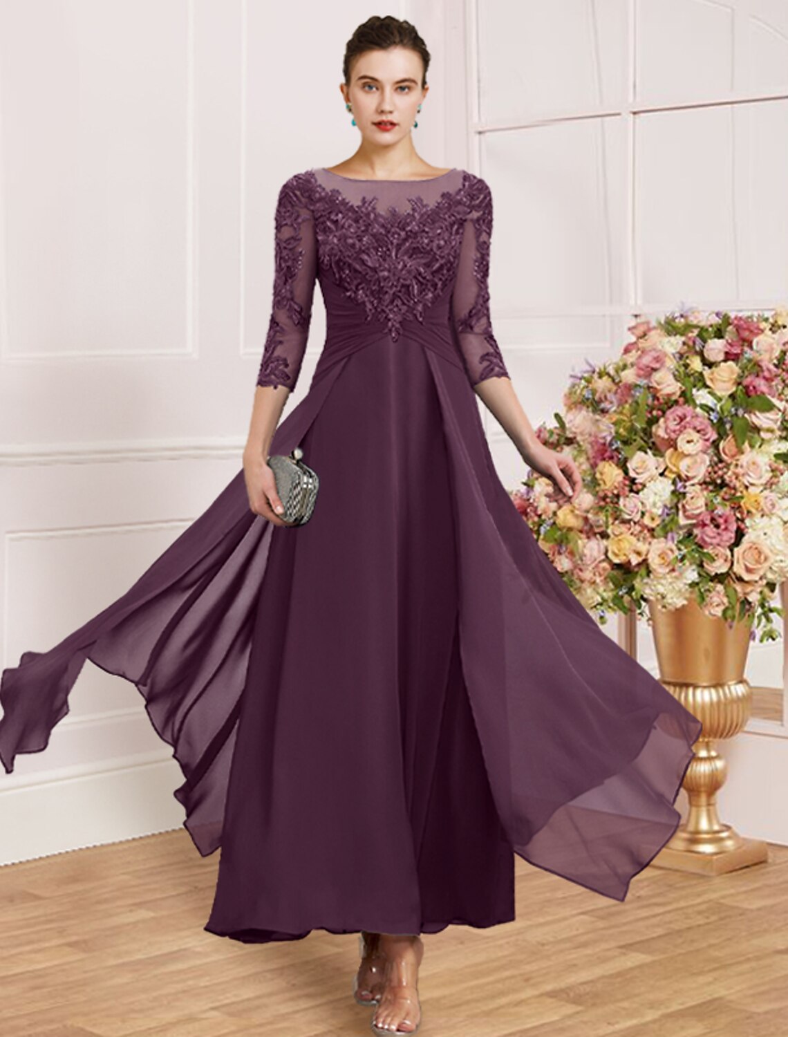 Close-up of the bodice and 3/4 sleeves of a grey sheath dress.