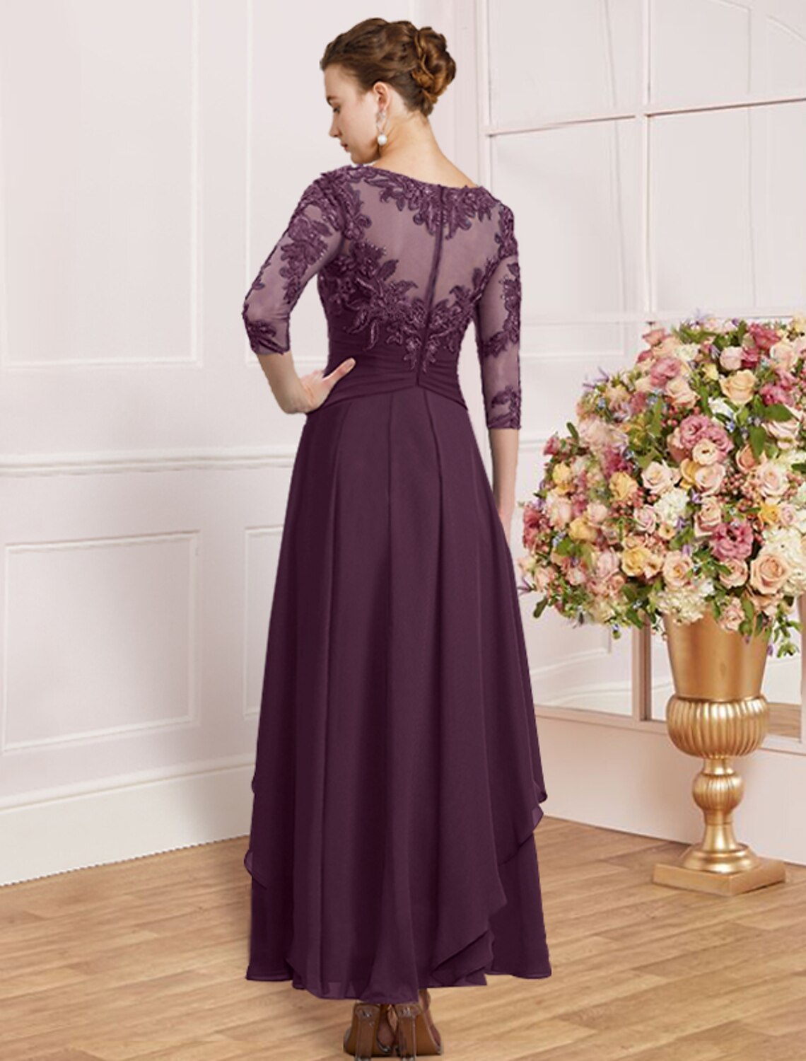 Full-length view of a model posing in a blue elegant sheath dress.