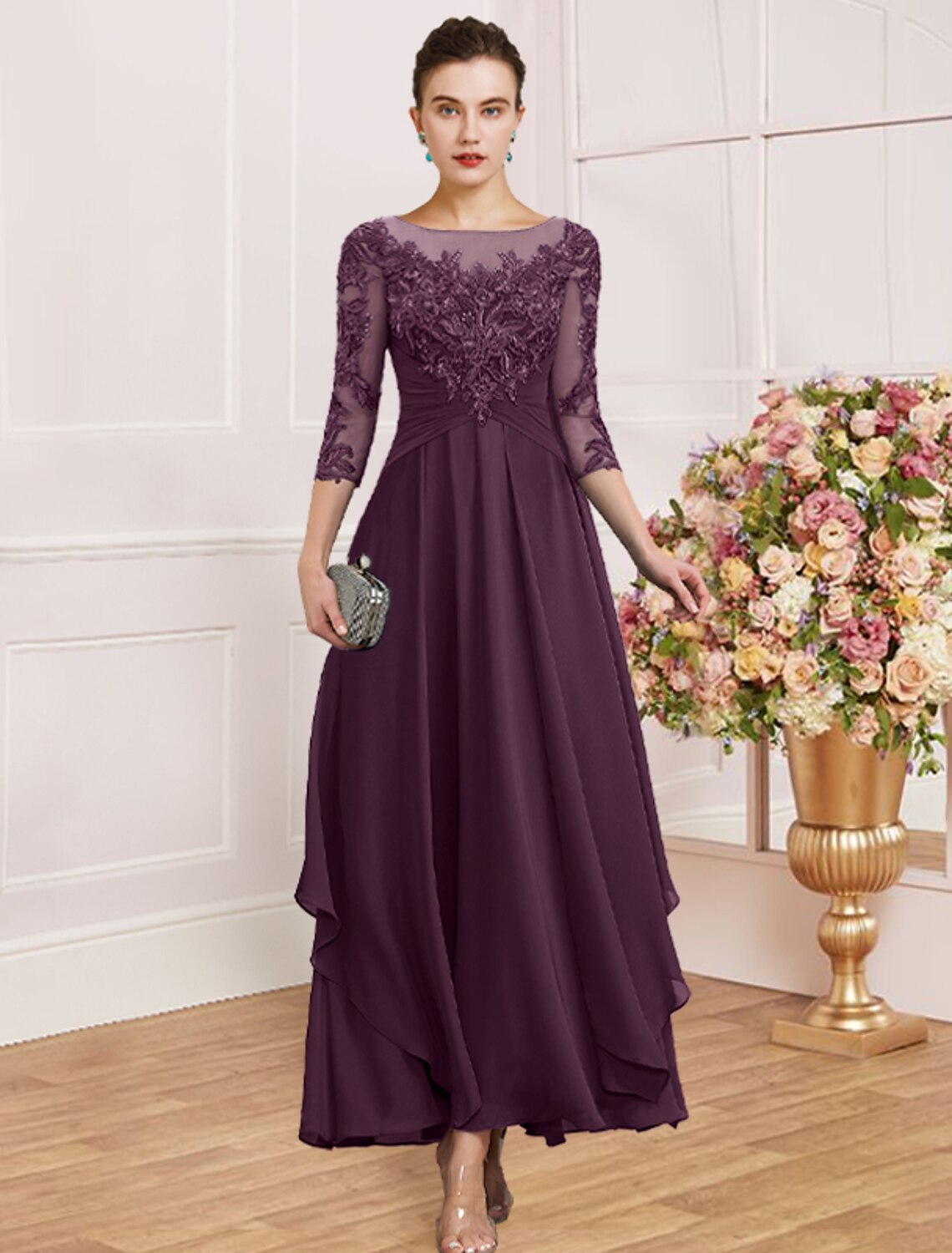 Model in a purple sheath dress, showing the graceful flow of the skirt.