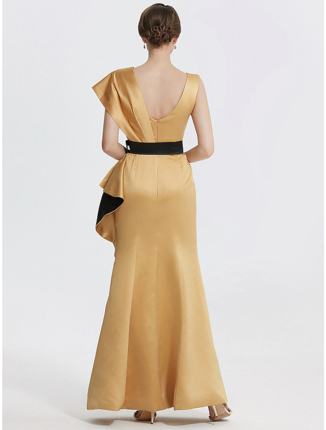 Close-up of the jewel neck and embroidered appliques on the satin evening gown.