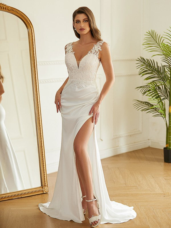 Side profile of the elegant Charmeuse wedding dress with a sweep train.