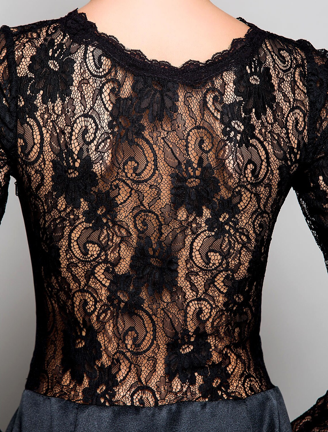 Detail of the long sleeves and lace fabric on the Weitese evening gown.