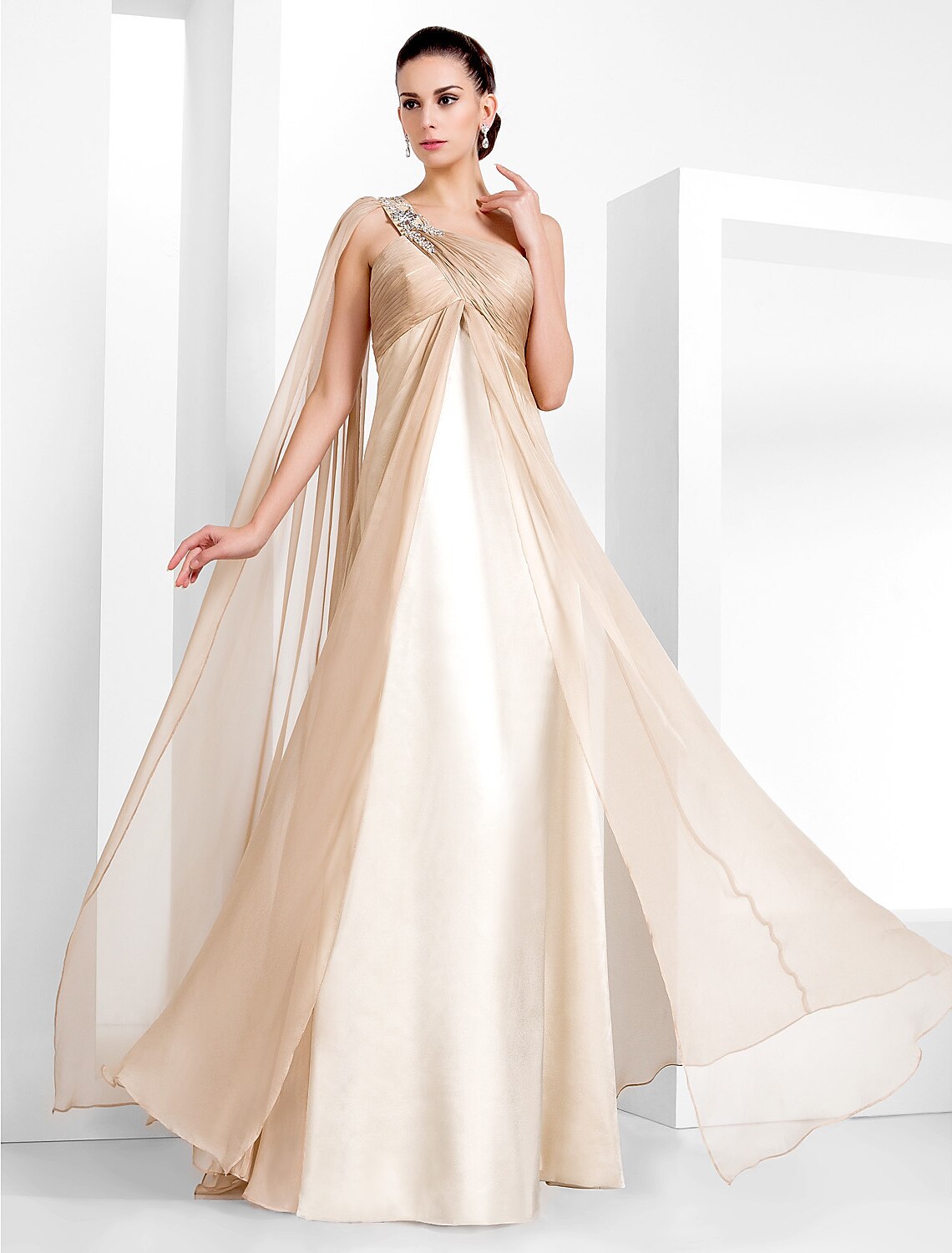 Model wearing a black one-shoulder floor-length sheath column gown with criss-cross crystal details.