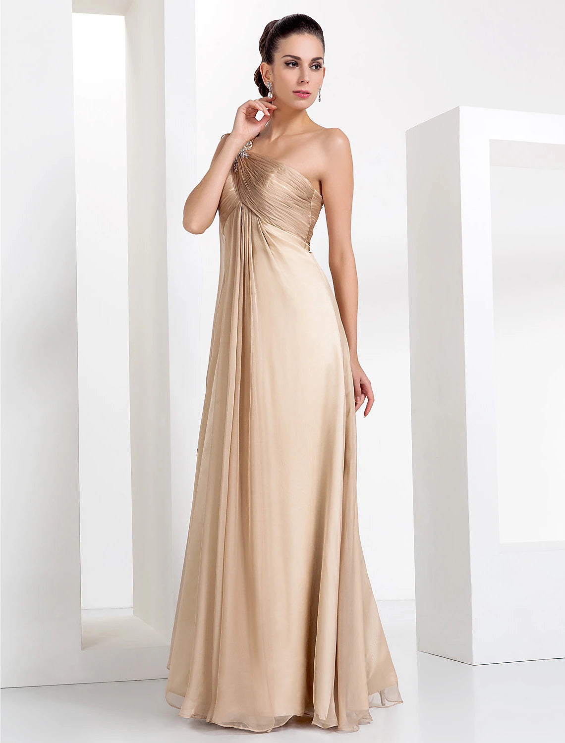 Back view of the black one-shoulder sheath column gown, showing the floor-length silhouette.