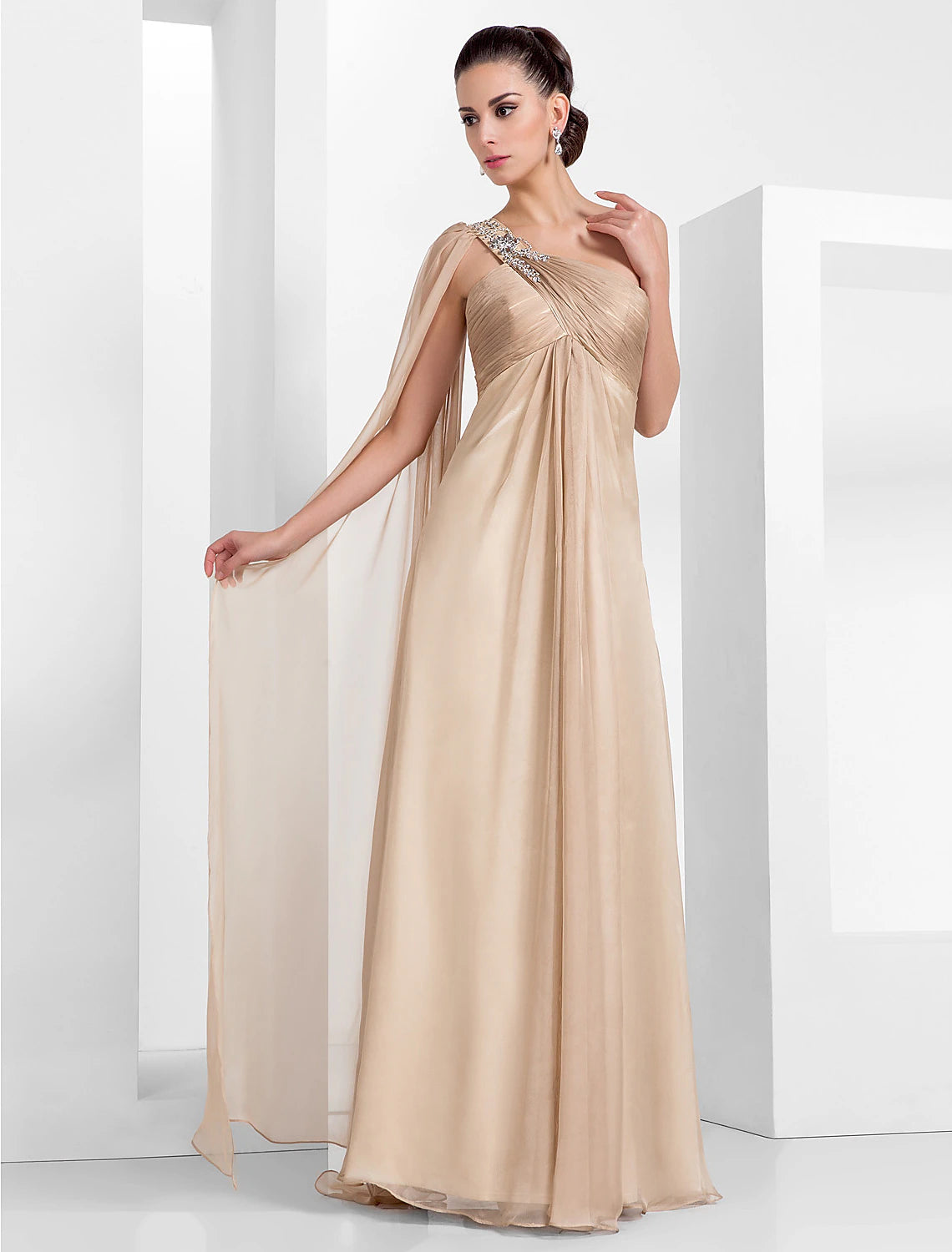Full-length view of the black one-shoulder gown, showcasing the sheath column silhouette.