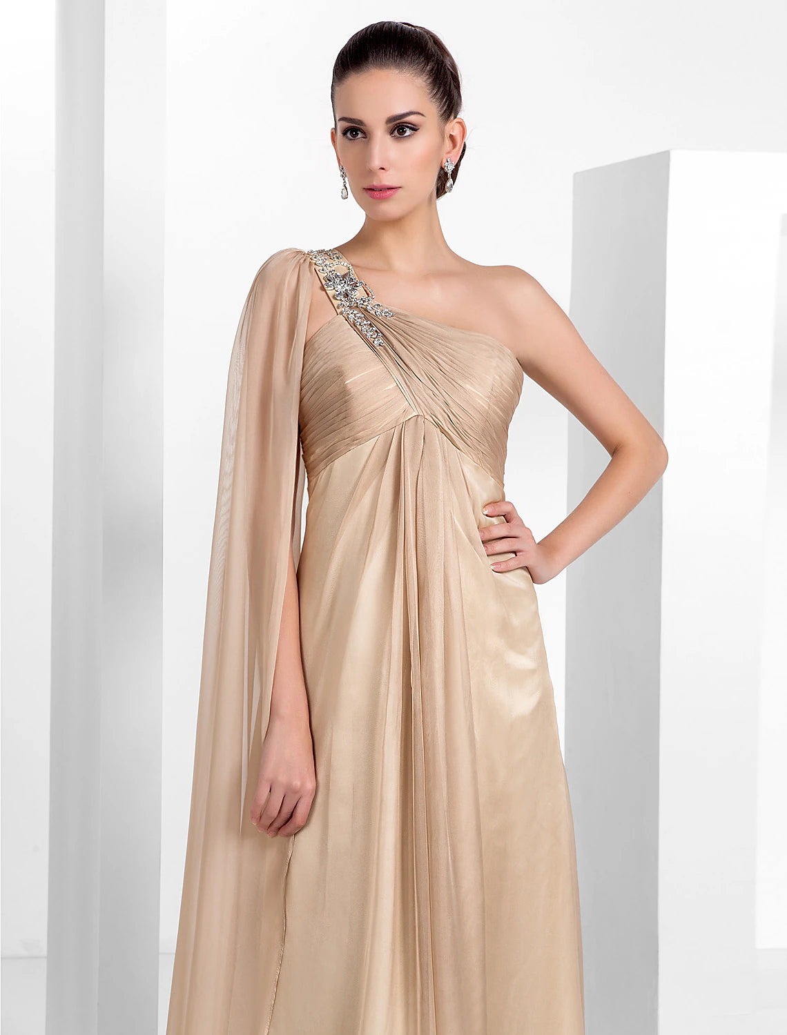 Detail of the criss-cross crystal design on the black chiffon fabric of the formal dress.