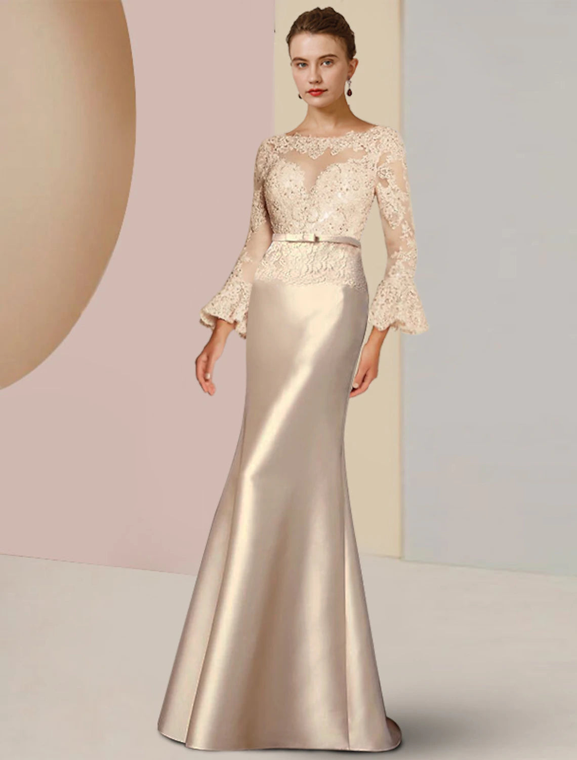 Woman wearing an elegant Weitese sheath column mother of the bride dress with long sleeves and scoop neck, front view.