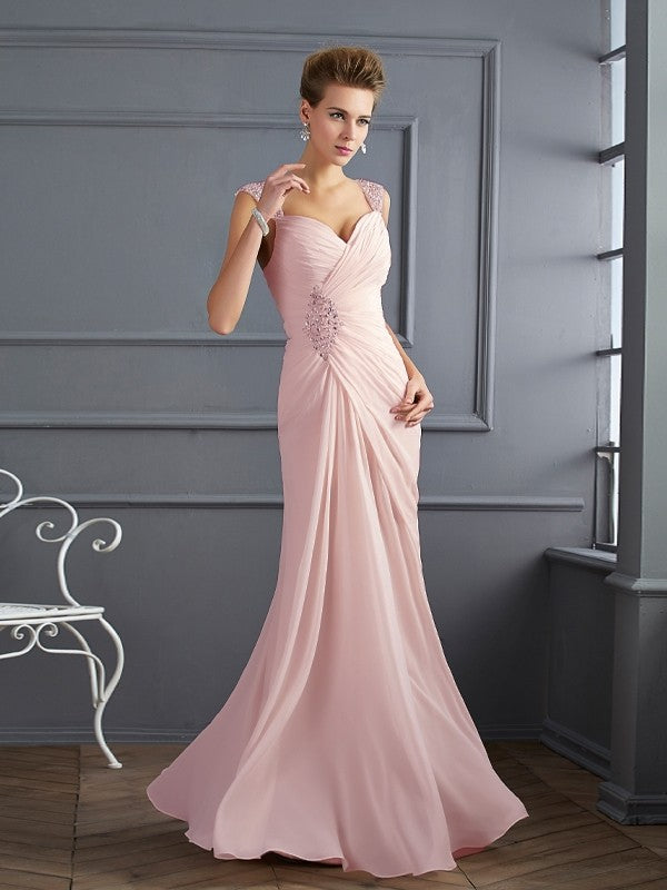 Side view of the flowing long chiffon prom dress.