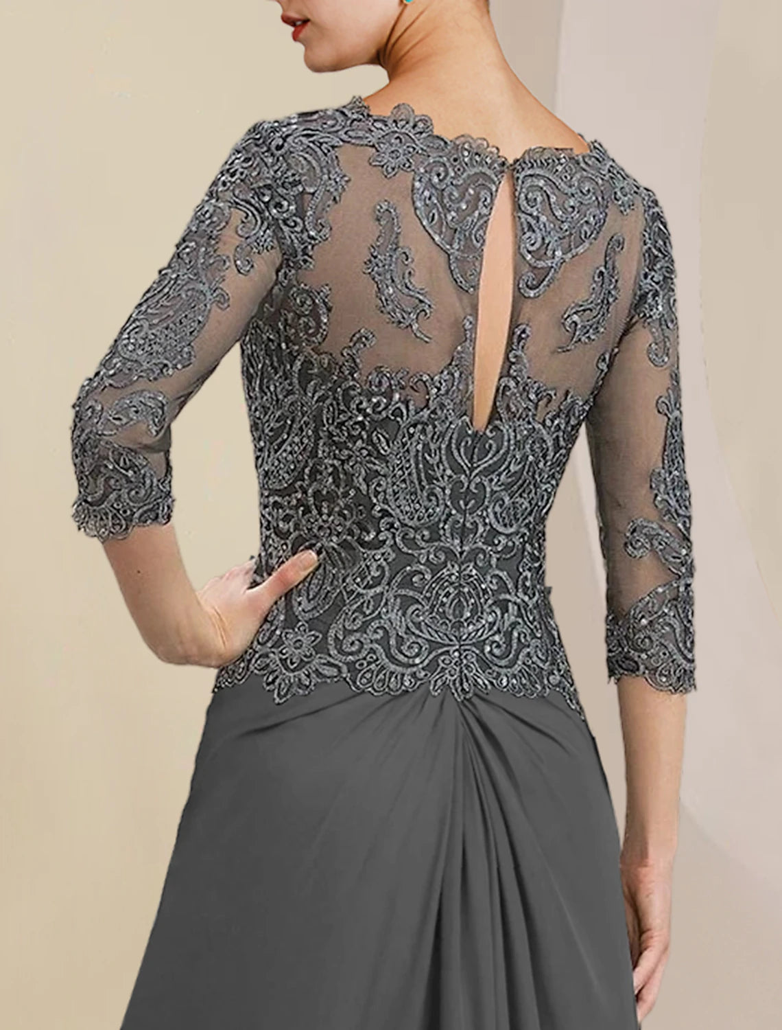 Back view of the elegant sheath column dress, highlighting the V-neck and flowing chiffon.