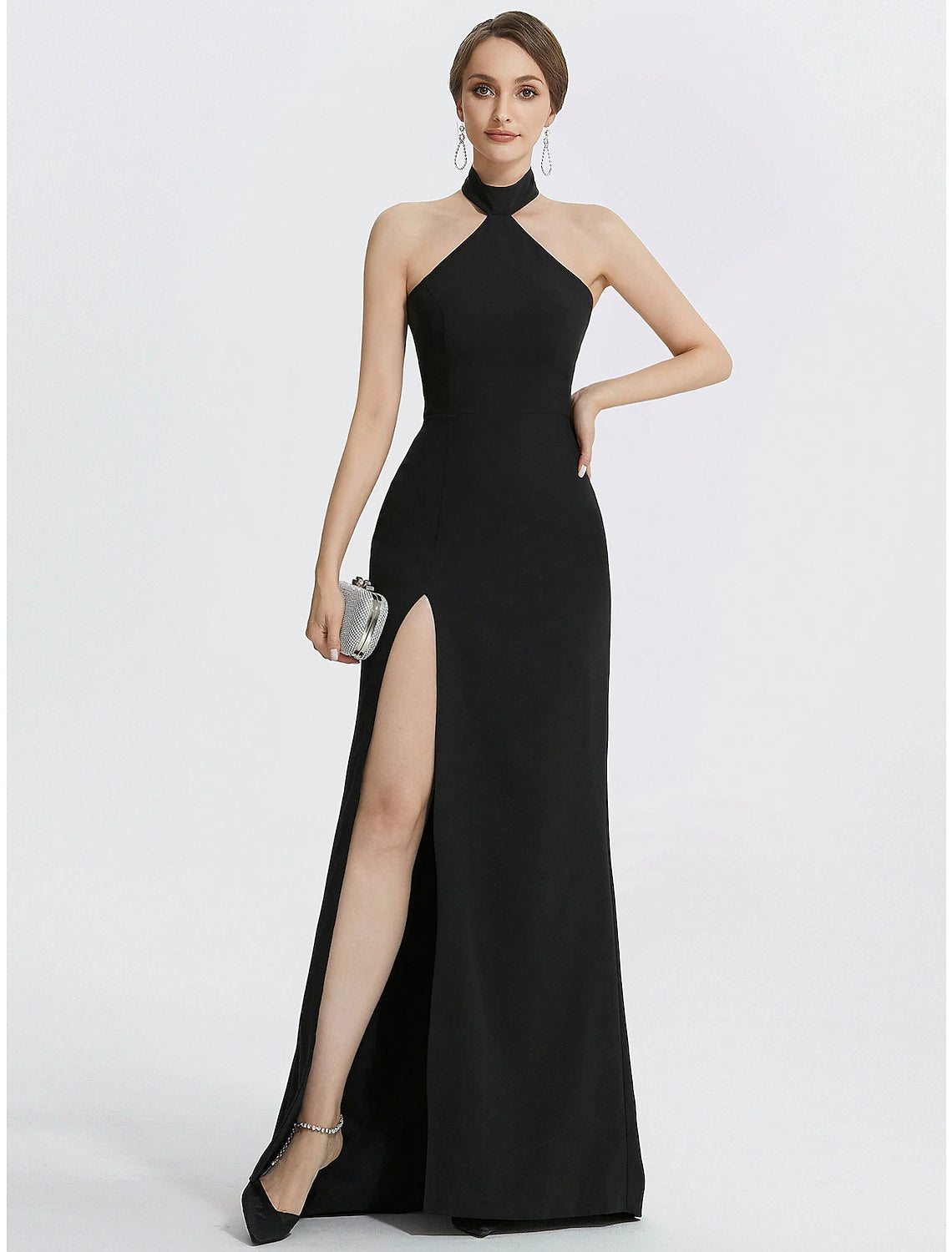 Model wearing a Weitese black halter neck ruched sheath evening gown, front view.