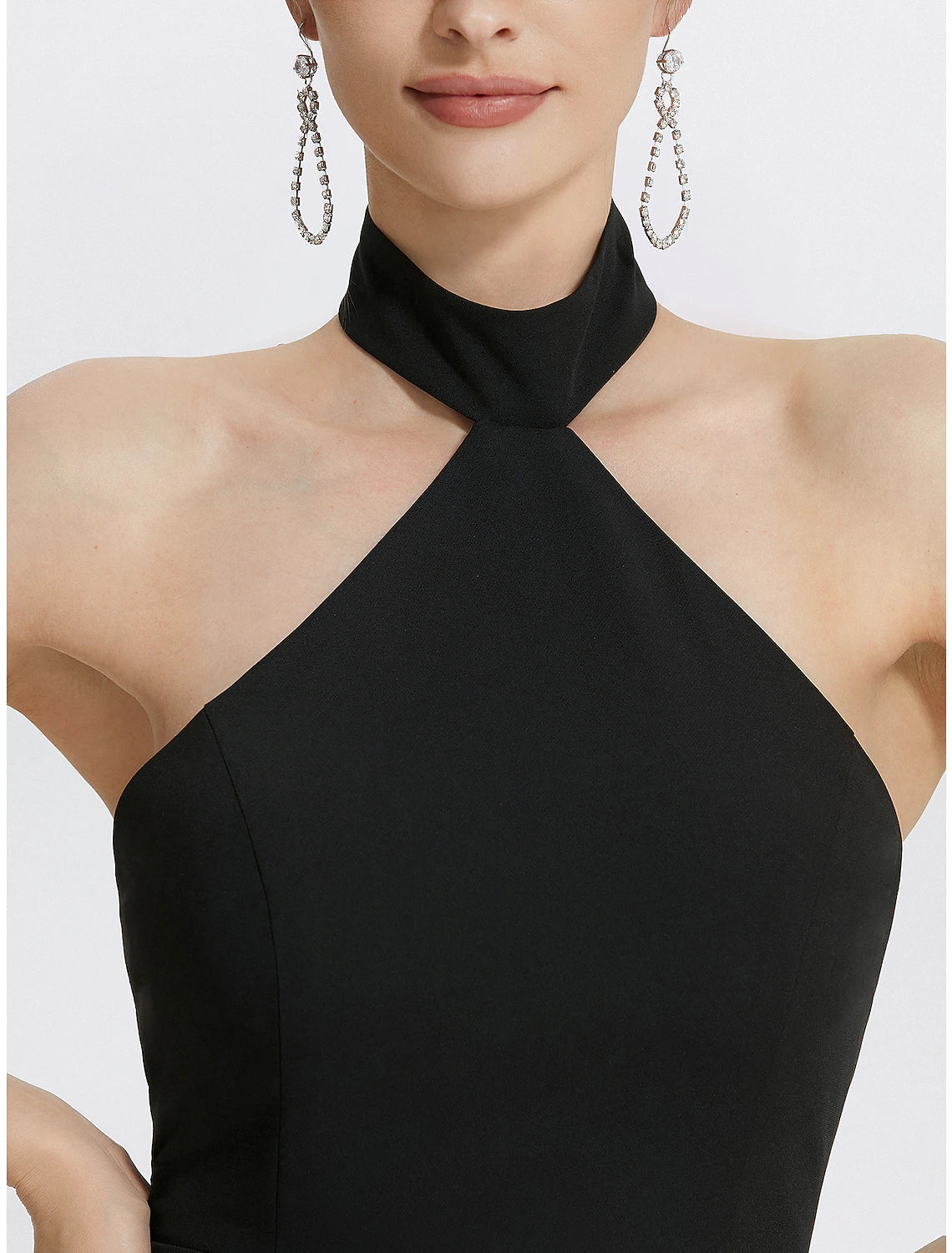 Close-up of the elegant ruched detail on the Weitese black evening gown.