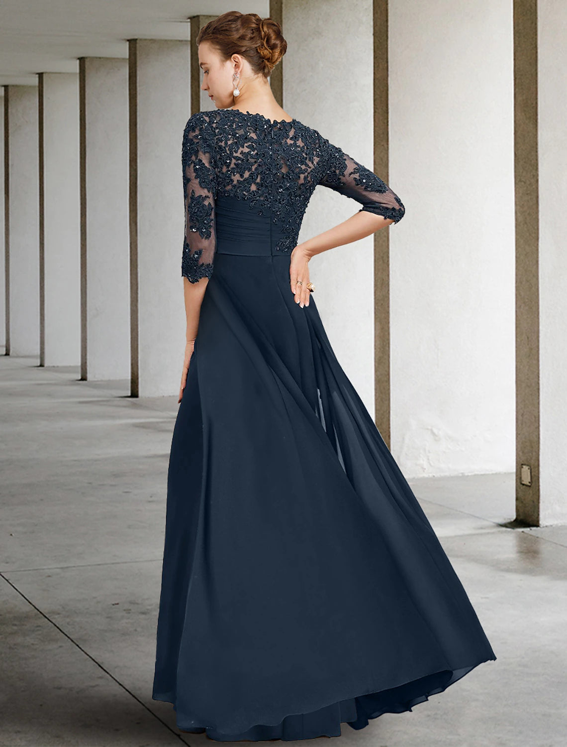 Side view of the floor-length chiffon lace mother of the bride dress.