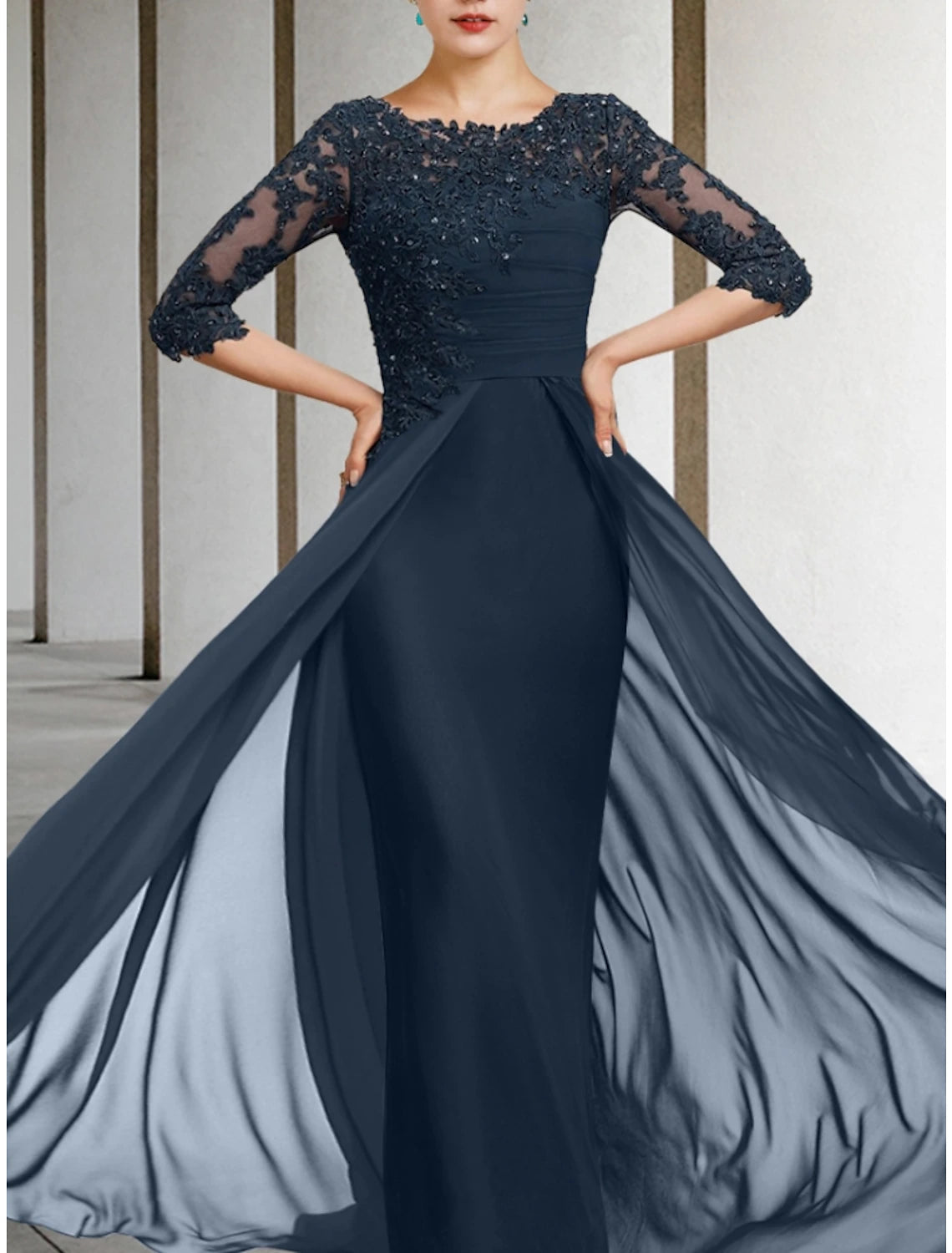Close-up of the intricate chiffon and lace fabric on the dress.