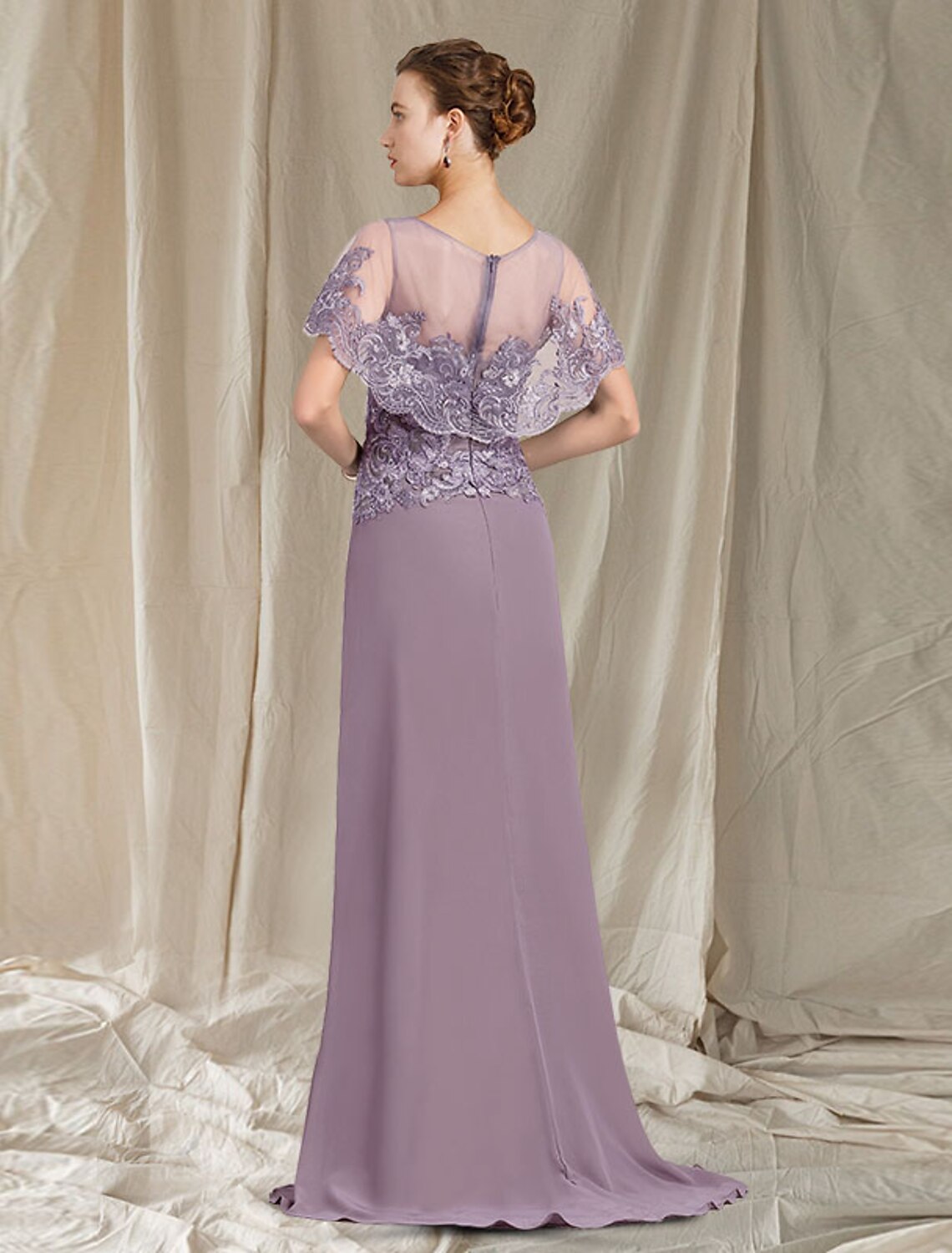 Full view of the elegant Mother of the Bride dress, highlighting chiffon and sweep train.