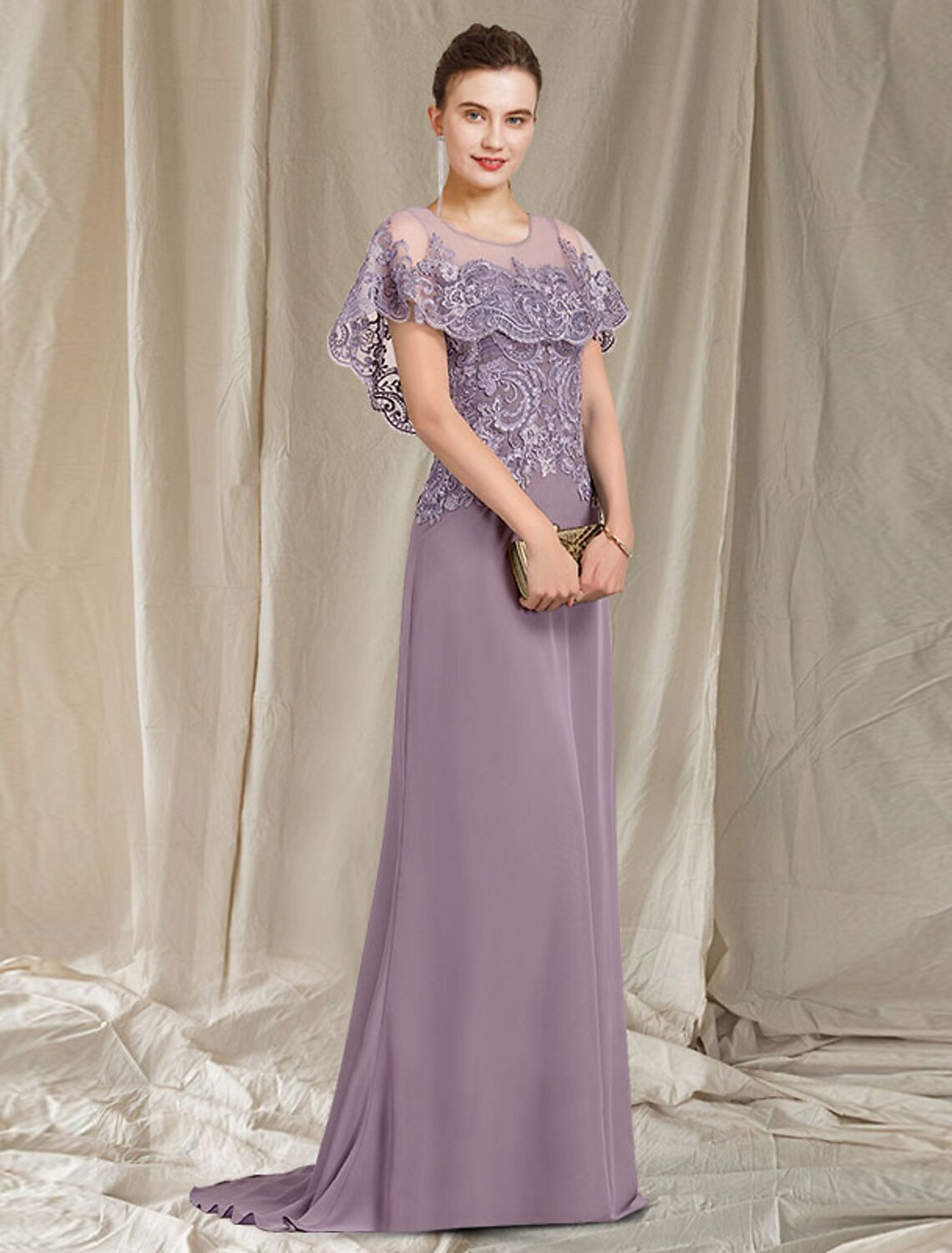 Detail of the lace appliques and ruffles on the elegant Mother of the Bride gown.