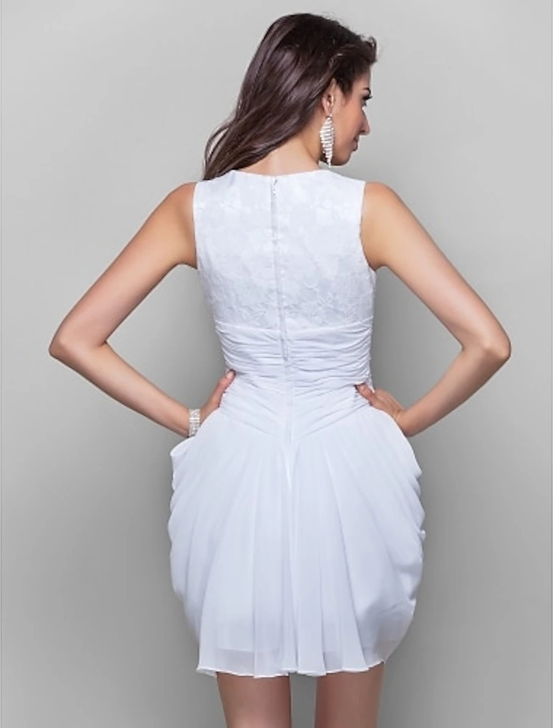 Back view of the elegant light-colored short sheath cocktail dress, highlighting its graceful silhouette.