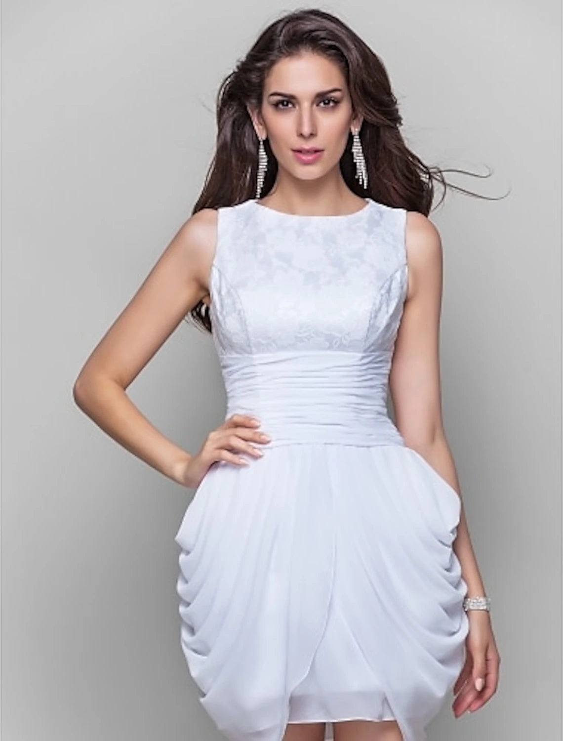 Close-up of the chiffon and lace fabric with ruched details on the cocktail dress.