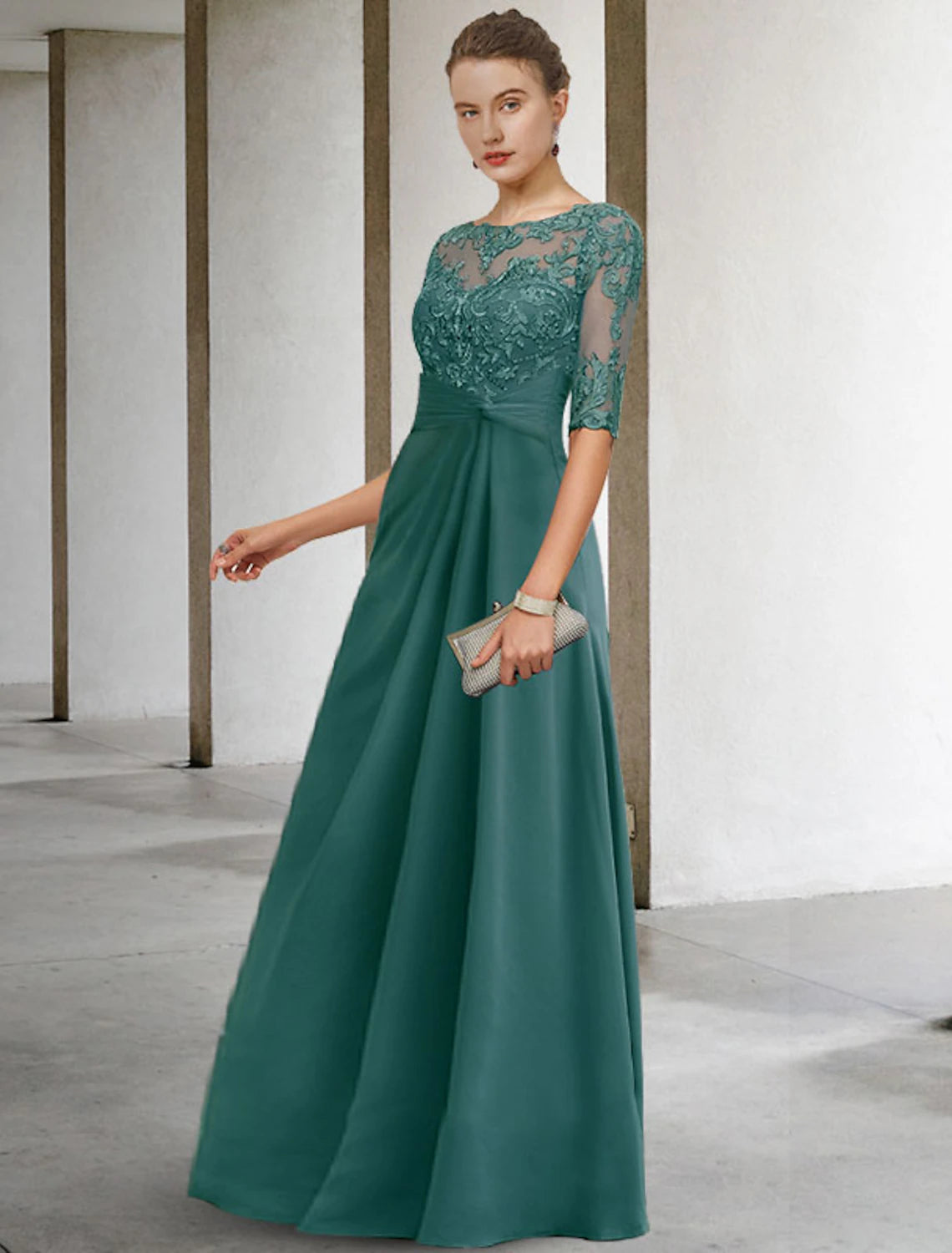 Full back view of the blue floor-length mother of the bride dress, showcasing its elegant drape.