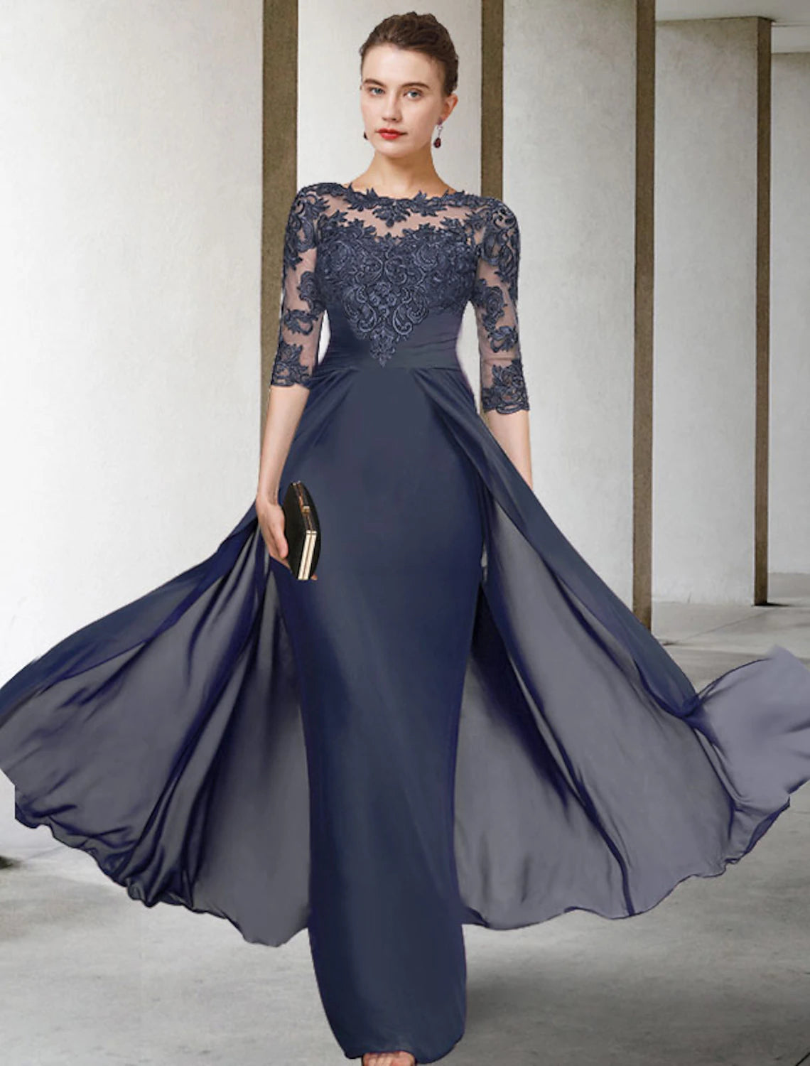 Elegant Mother of the Bride dress with jewel V-neck and half sleeves.