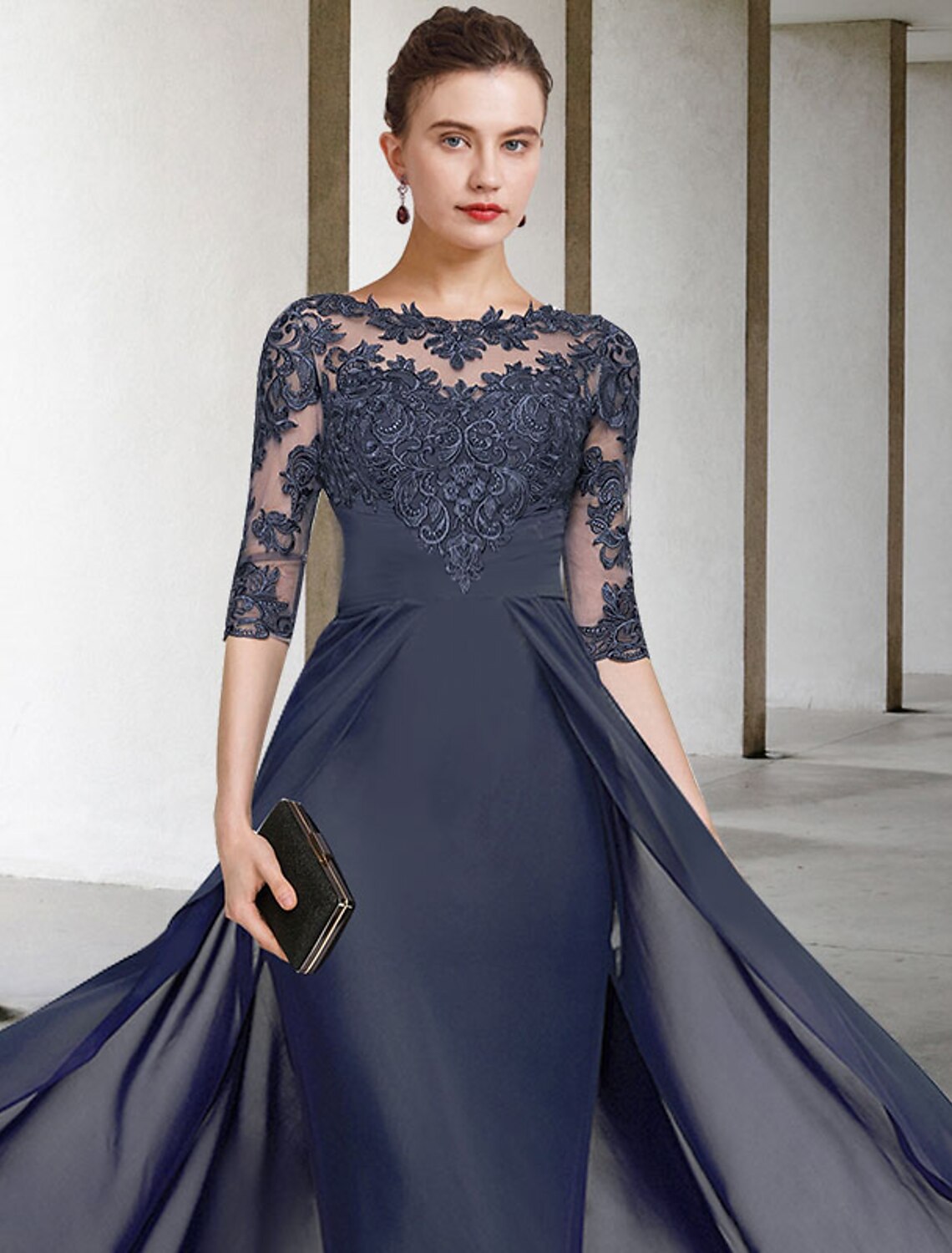 Close-up of the dress's jewel V-neckline and ruched lace details.