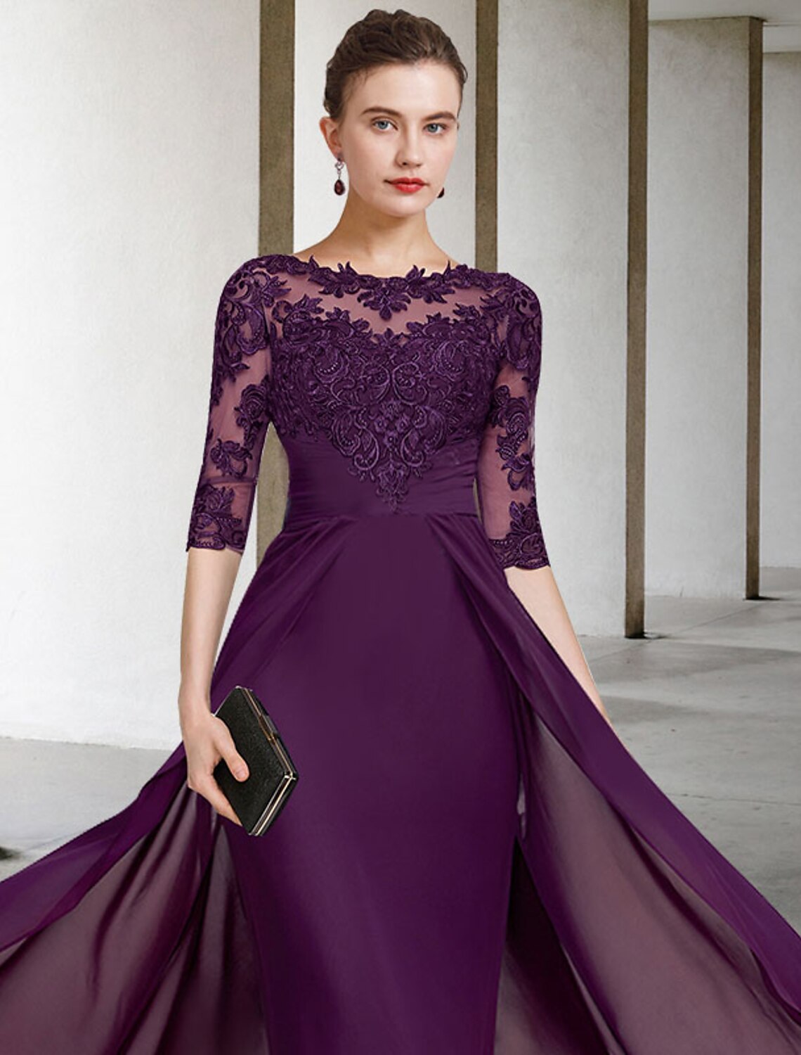 Fabric detail of lace appliques and chiffon on the dress.