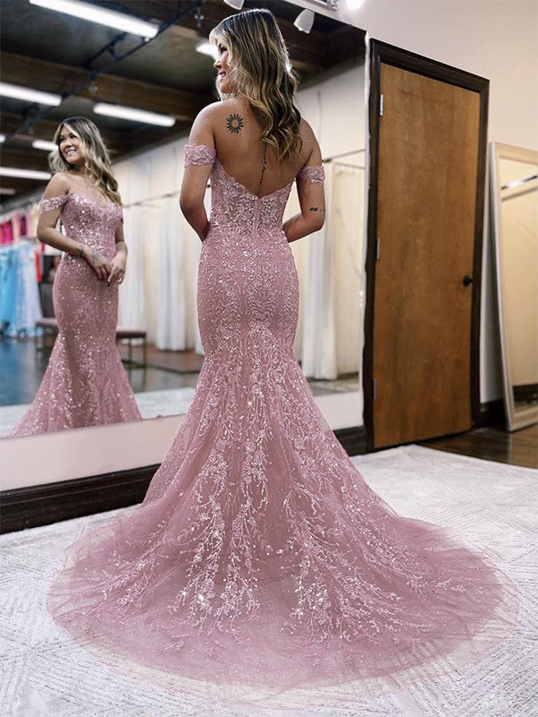 Close-up of the lace applique and off-the-shoulder neckline of the prom dress.