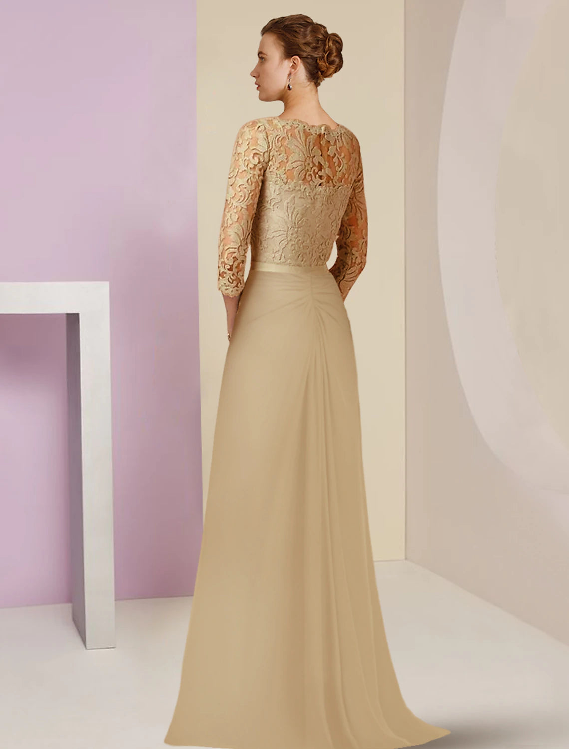 Side view of a woman wearing the floor-length chiffon lace gown.