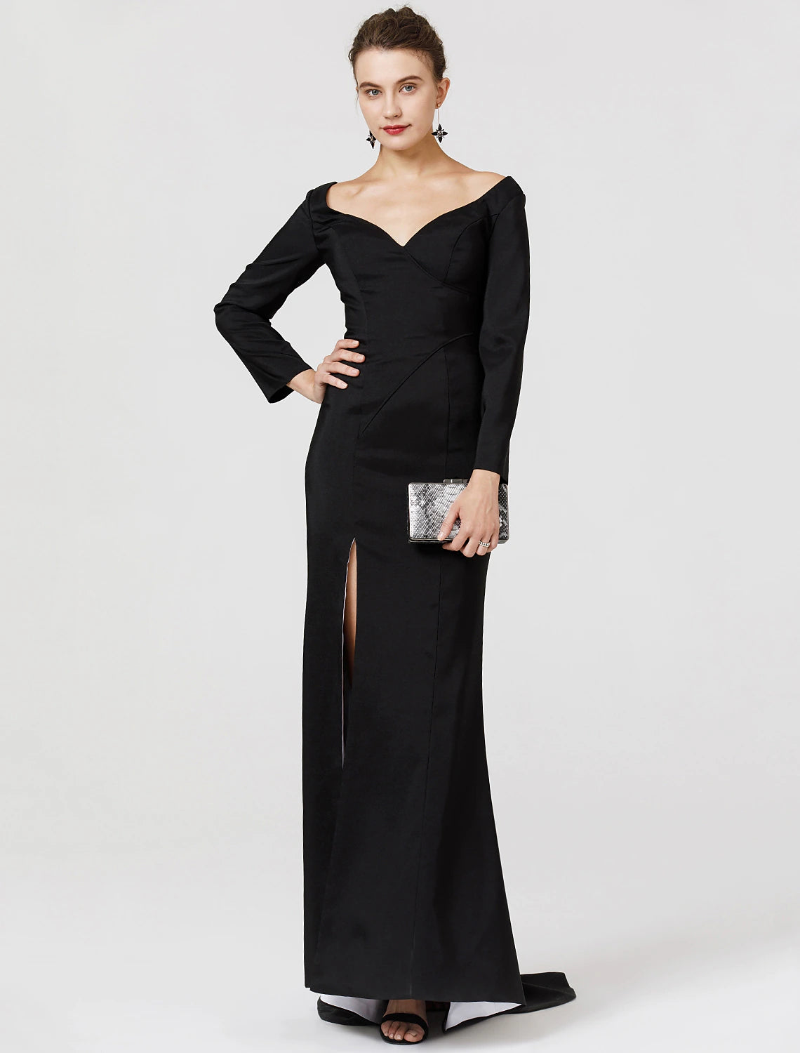 Back view of a woman in a dark stretch satin prom dress, highlighting the sweep train.