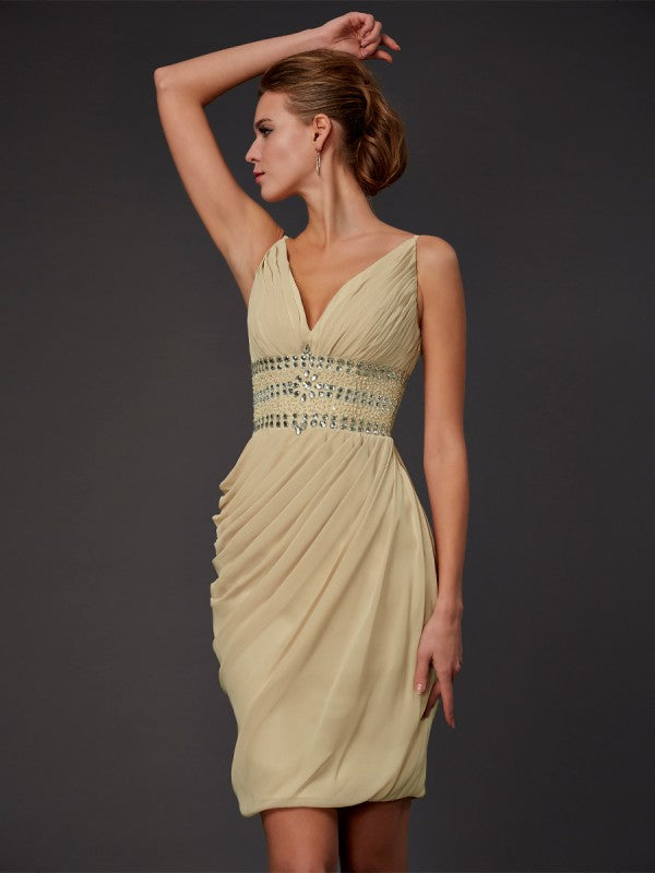 Woman modeling a short V-neck beaded chiffon sheath homecoming dress.