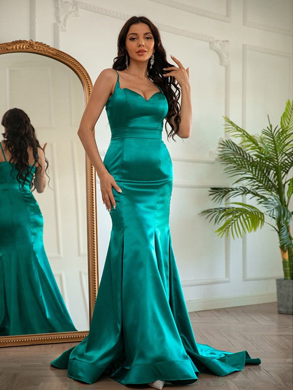 Elegant light-colored sheath V-neck ruched satin prom dress with a sweep train.