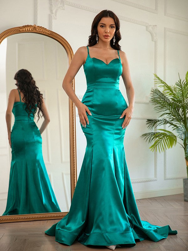 Side view of a woman wearing the ruched V-neck satin prom dress.