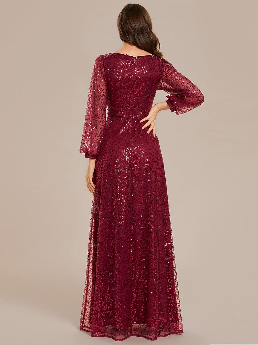 Back view of a woman in a red sequin A-line evening dress, showcasing the elegant silhouette.