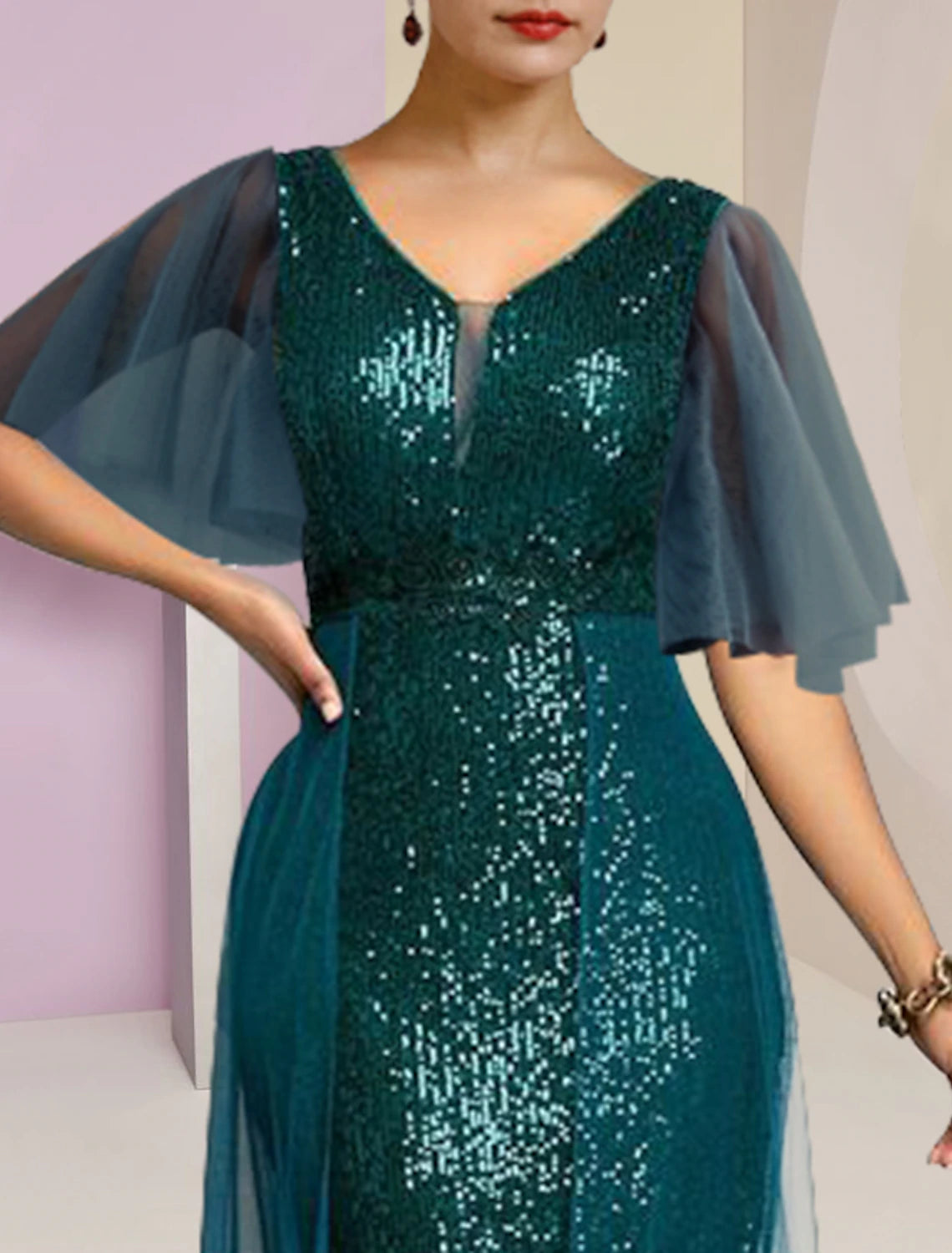 Back view of the sequined chiffon formal dress with pleats.
