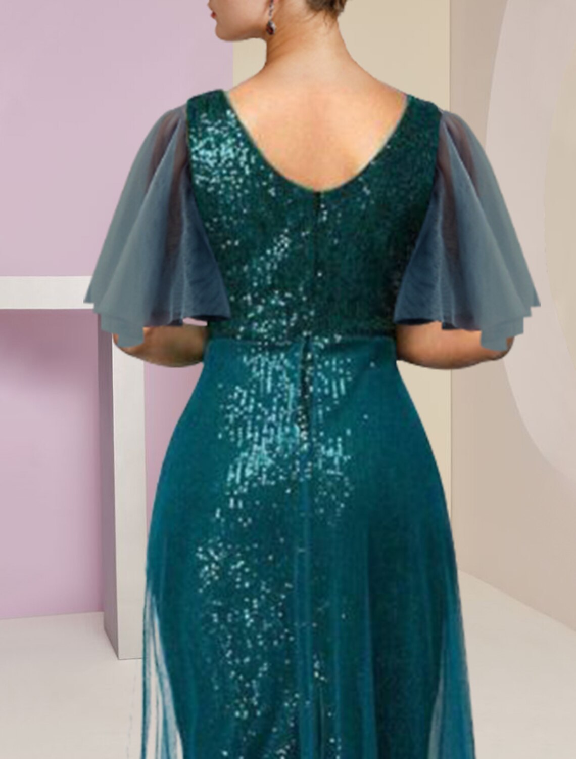 Close-up of the V-neckline and sequin details on the short sleeve dress.
