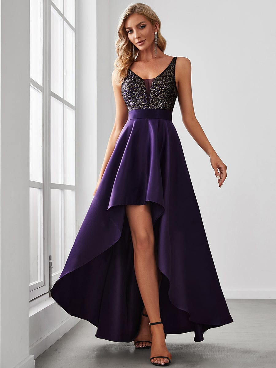Woman in purple sparkly bodice high-low prom dress.