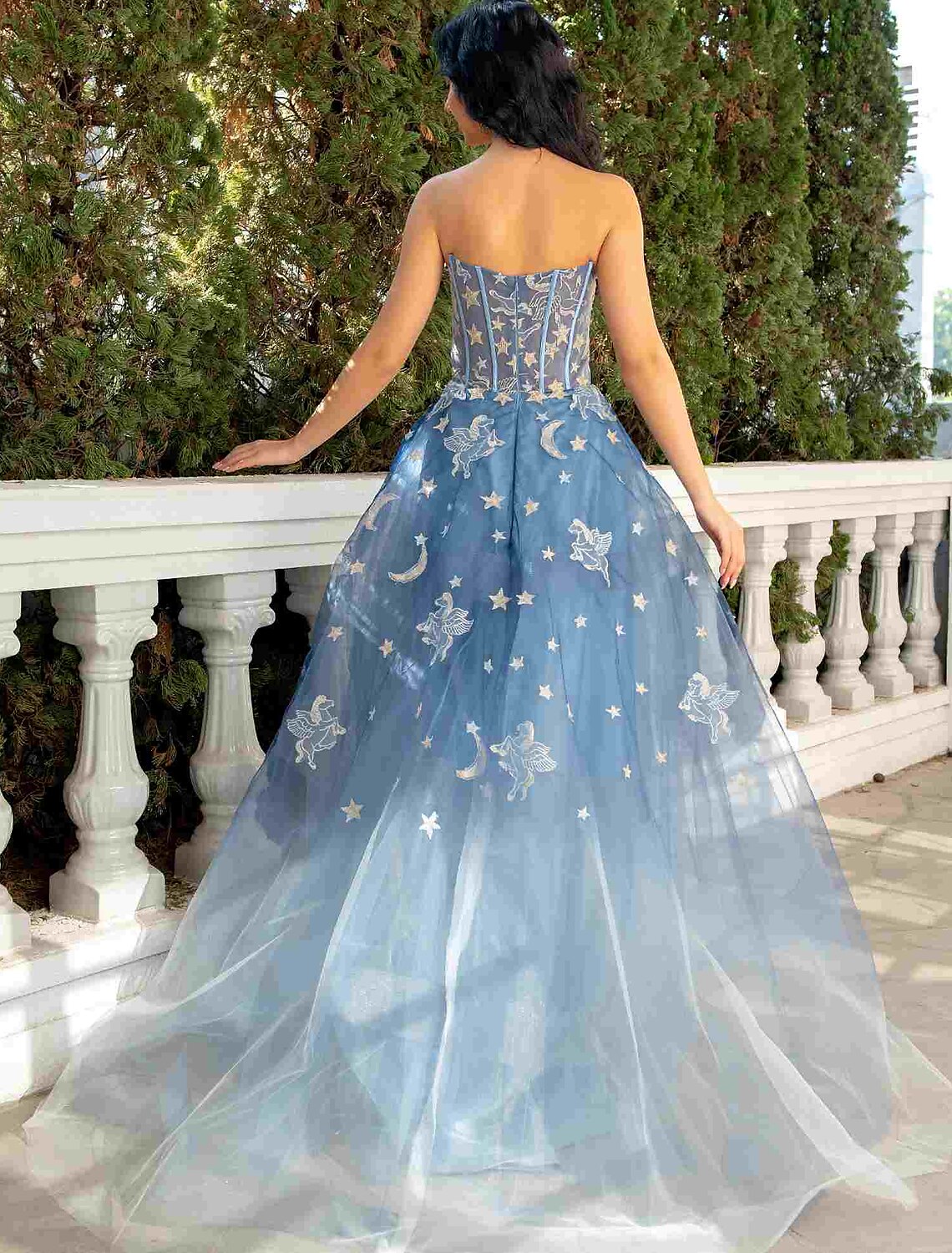 Side view of the elegant ball gown, showcasing the court train.