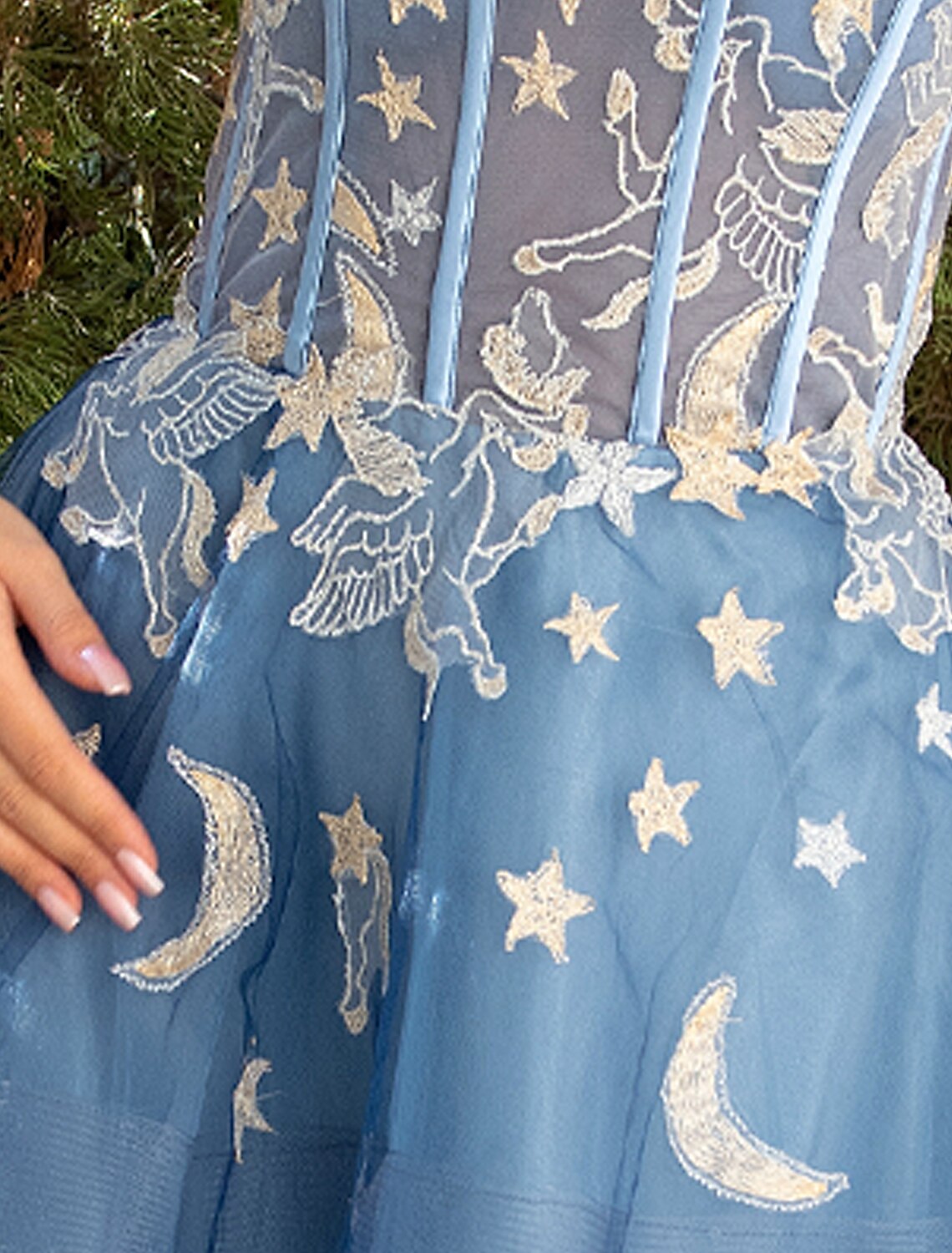 Full length view of the ball gown, showing its elegant silhouette.