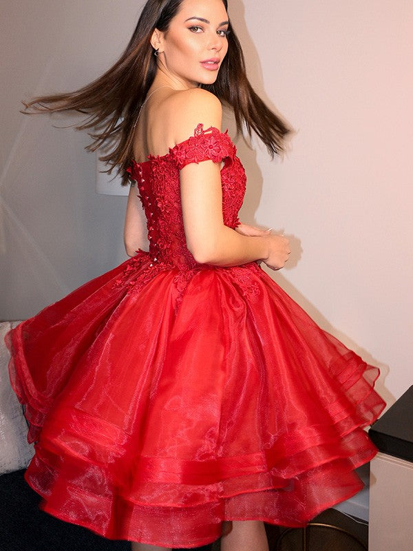 Back view of teal off-the-shoulder homecoming dress.