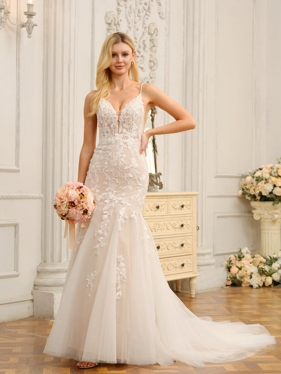 Elegant white trumpet mermaid wedding dress with spaghetti straps and intricate appliques.
