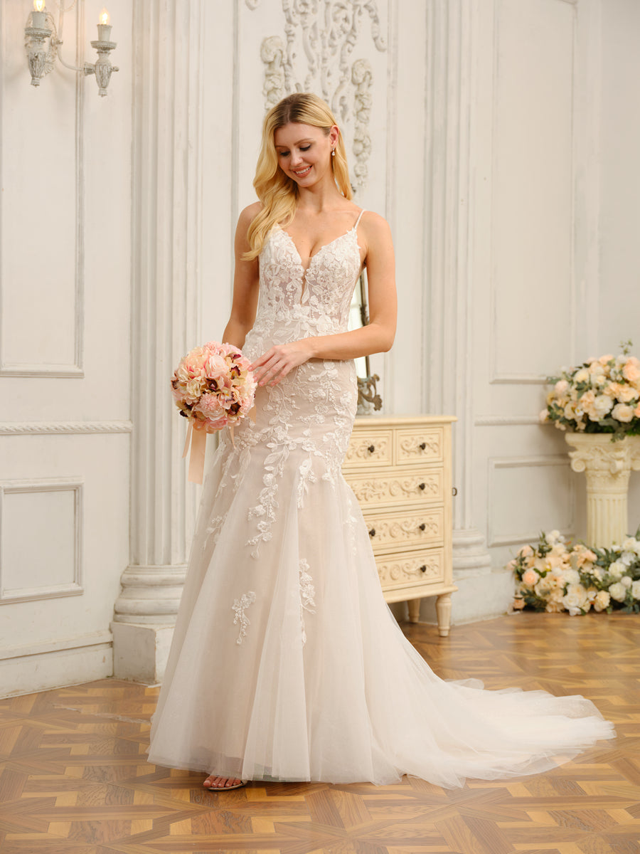 Close-up of the exquisite floral appliques and fabric on the Weitese wedding gown.
