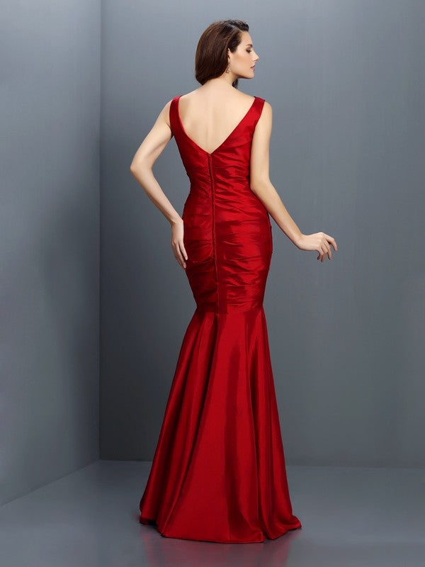 Full-length view of a sleeveless Trumpet Mermaid Bridesmaid Gown featuring a V-neck and delicate flowers.