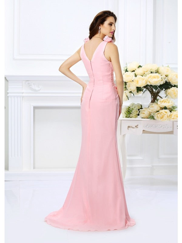 Back view of a model in a long trumpet mermaid bridesmaid dress, showcasing the flowing chiffon fabric.