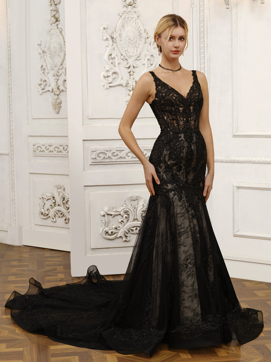 Close-up of the V-neckline and delicate lace details on the wedding dress.