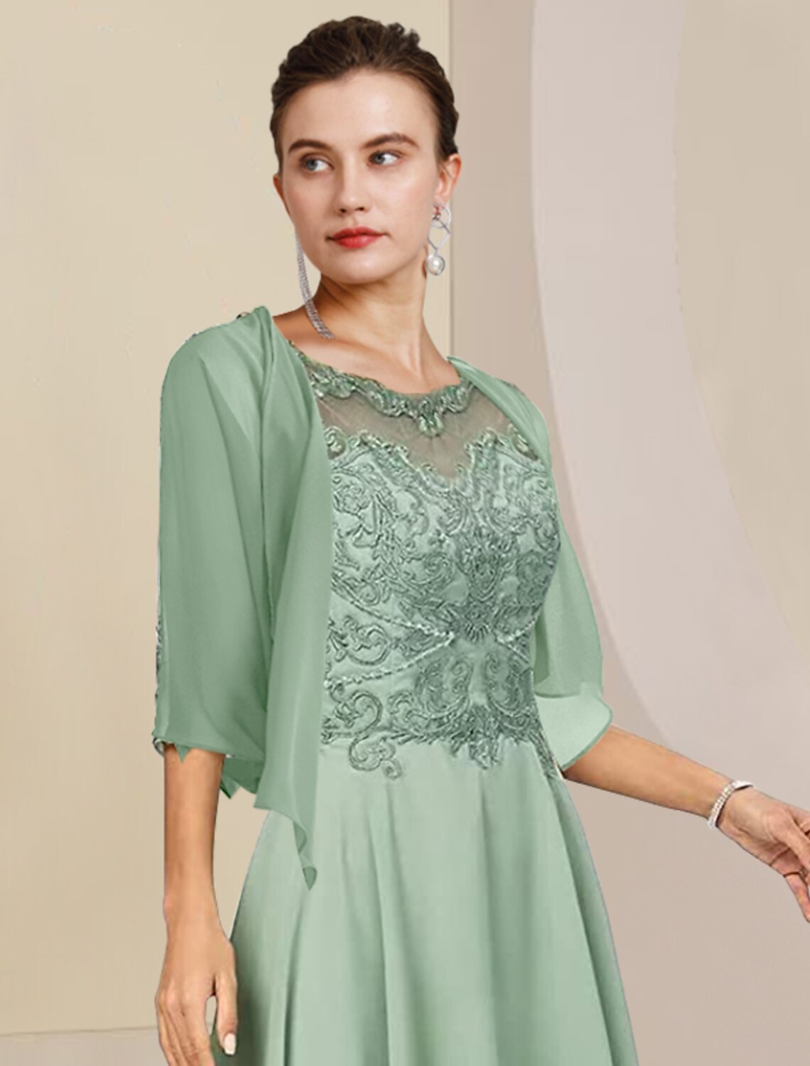 Back view of the two-piece formal dress with scoop neck and half sleeves.