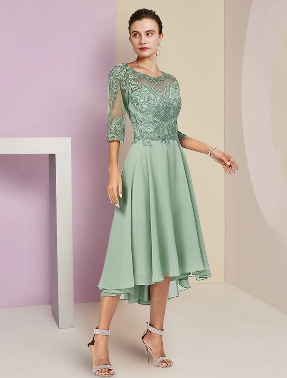 Model wearing the elegant two-piece dress with included matching wrap.