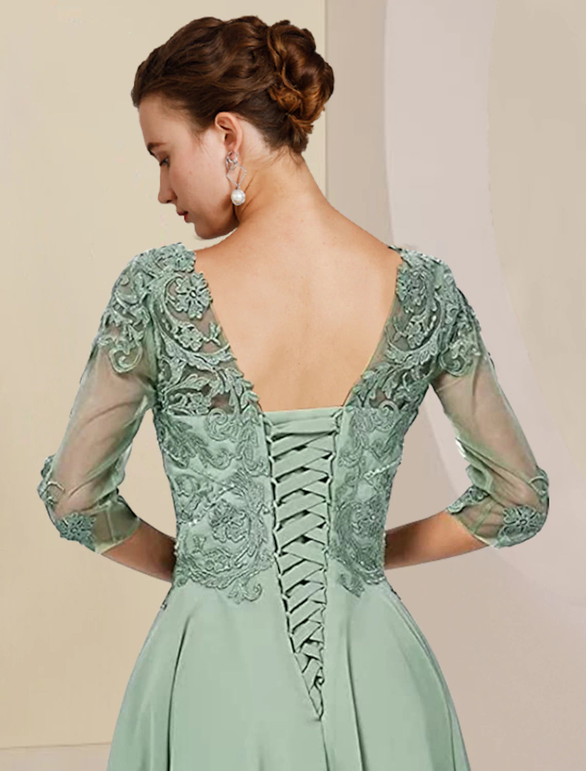 Scoop neck and half sleeve detail of the formal mother of the bride gown.